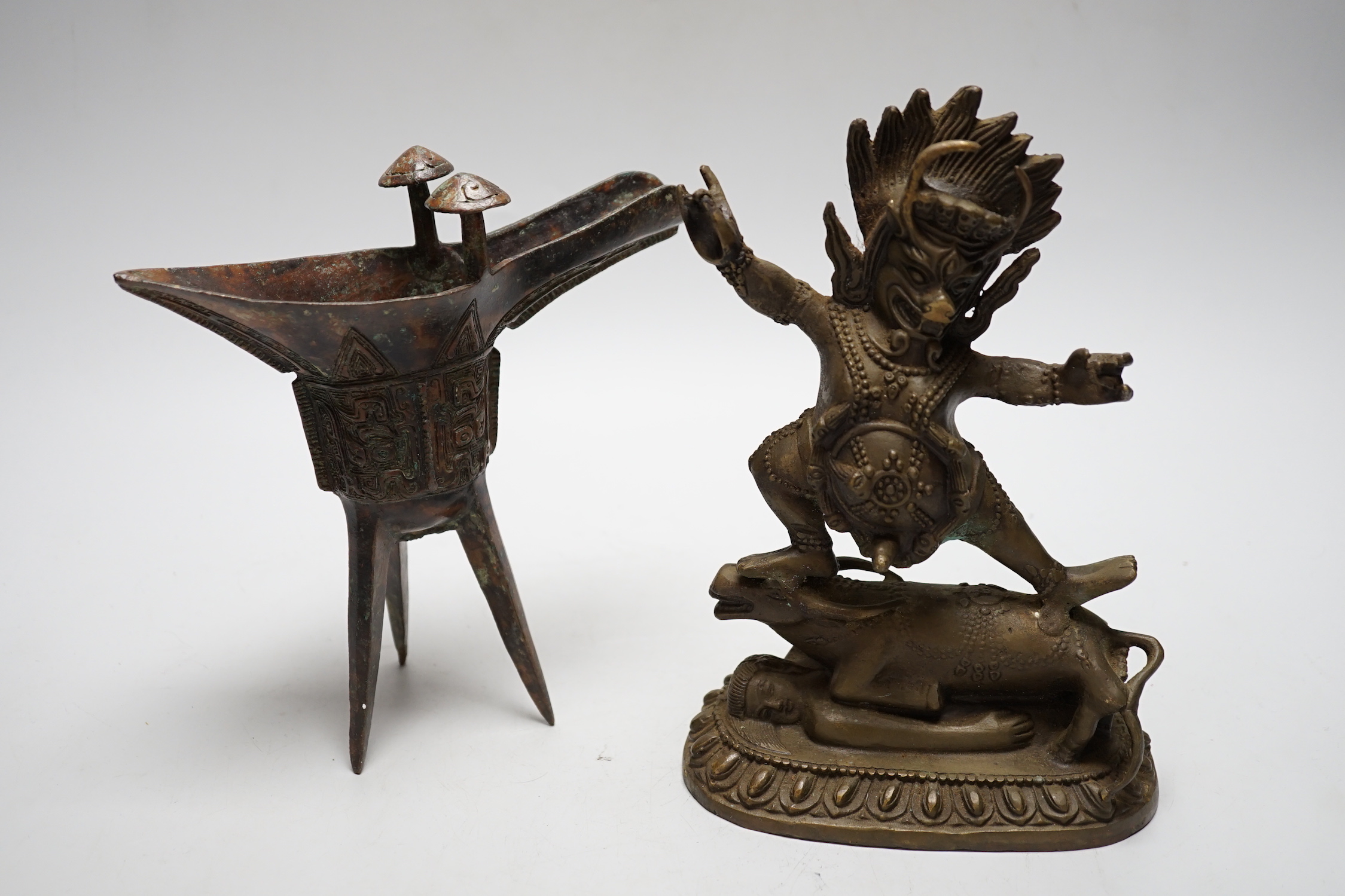 A Buddhist bronze figure and a bronze yi vessel, figure 22cm high